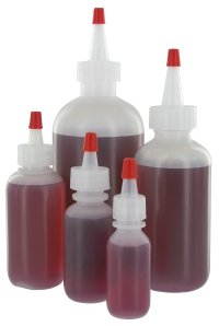 Dispensing bottles with nozzles