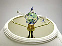 Glass finial bonded to brass lamp fixture