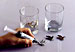 Metal emblems bonded to glass