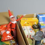 D Spencer elf helping with our food bank